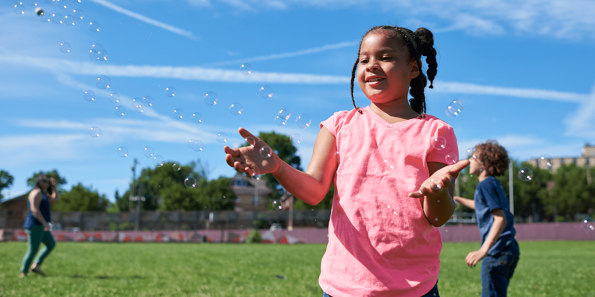 An image of a girl playing outside.